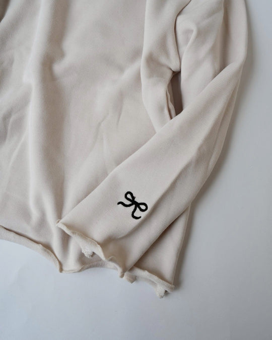 リボンステッチスムースメロウトップス