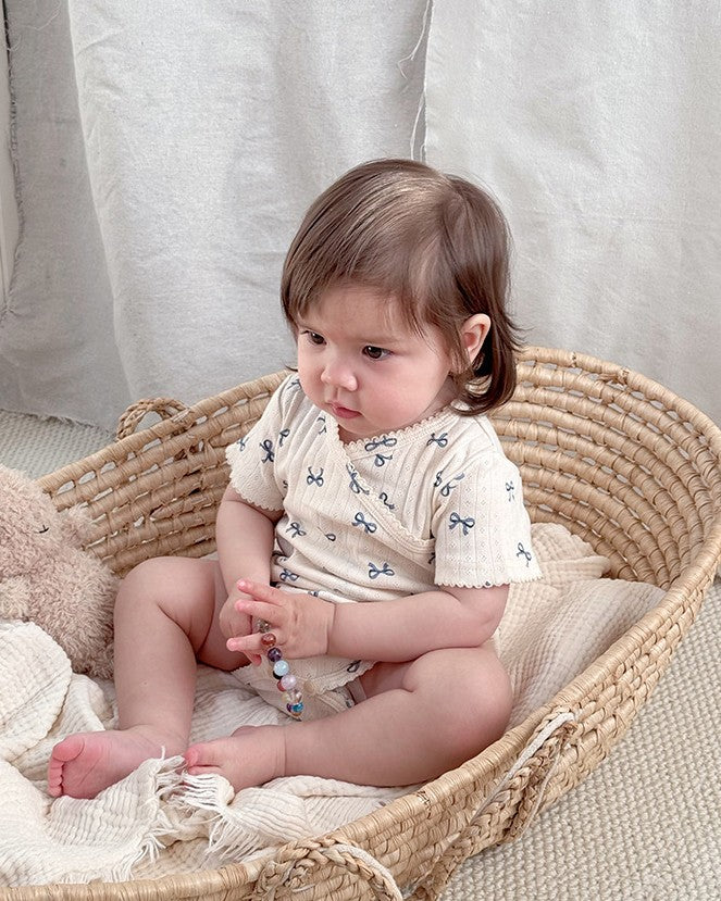 前開きアイレットリボンロンパース