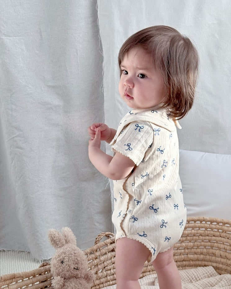 前開きアイレットリボンロンパース