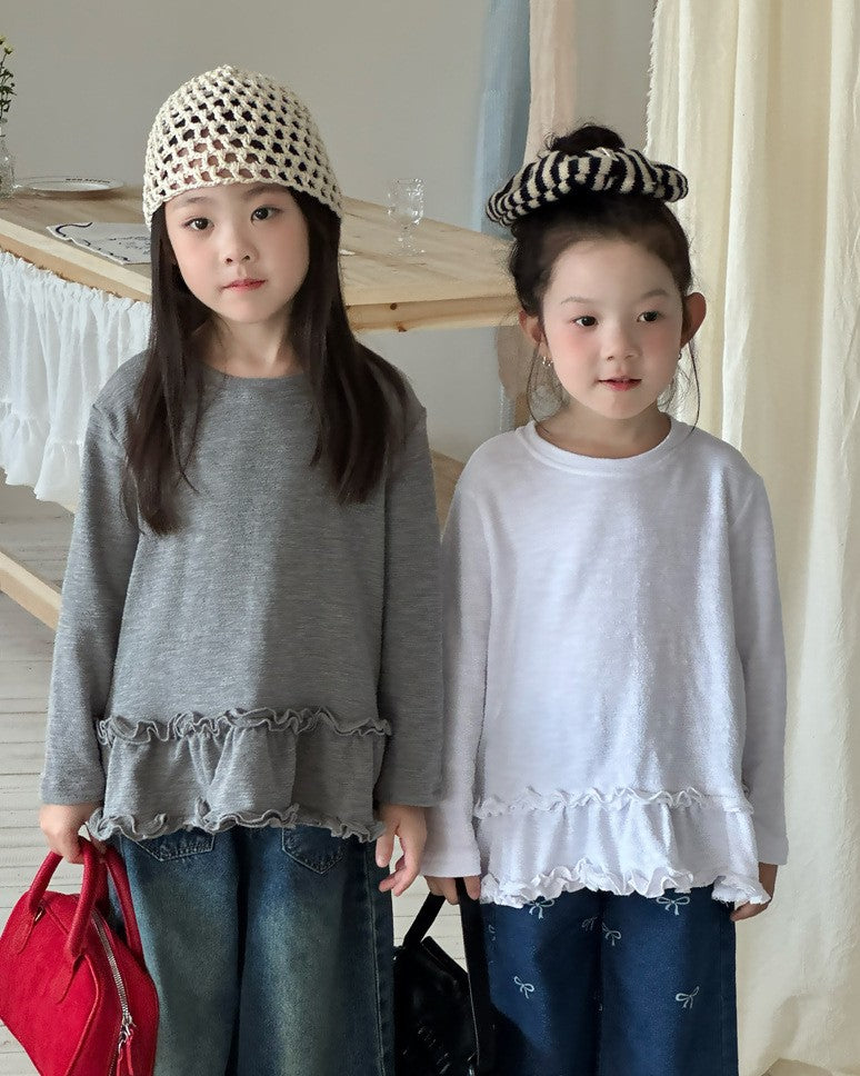 裾フリルトップス