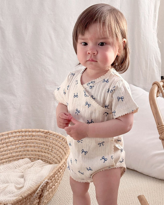 前開きアイレットリボンロンパース