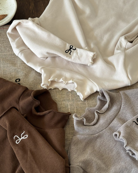 リボンステッチスムースメロウトップス