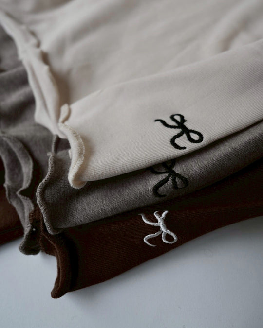 リボンステッチスムースメロウトップス