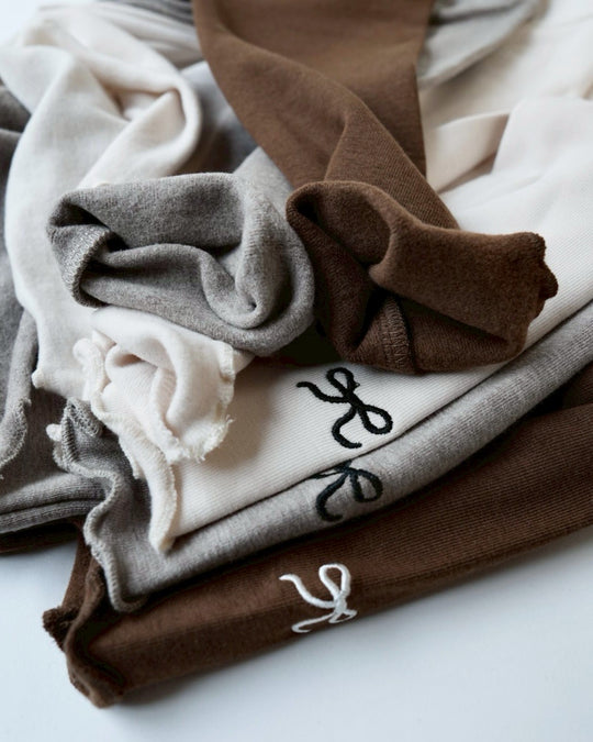 リボンステッチスムースメロウトップス