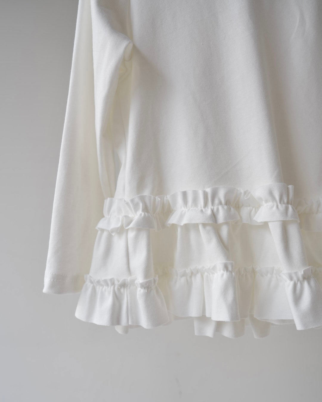 裾フリルトップス