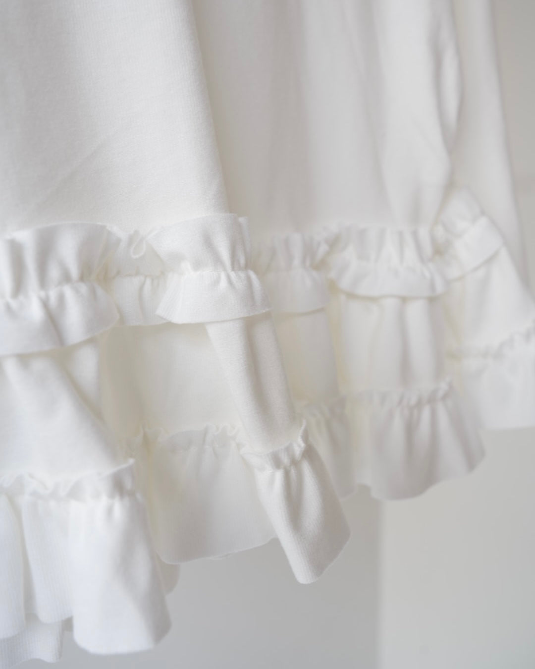 裾フリルトップス