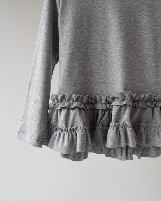 裾フリルトップス