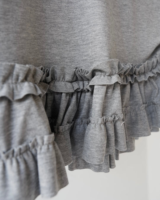 裾フリルトップス