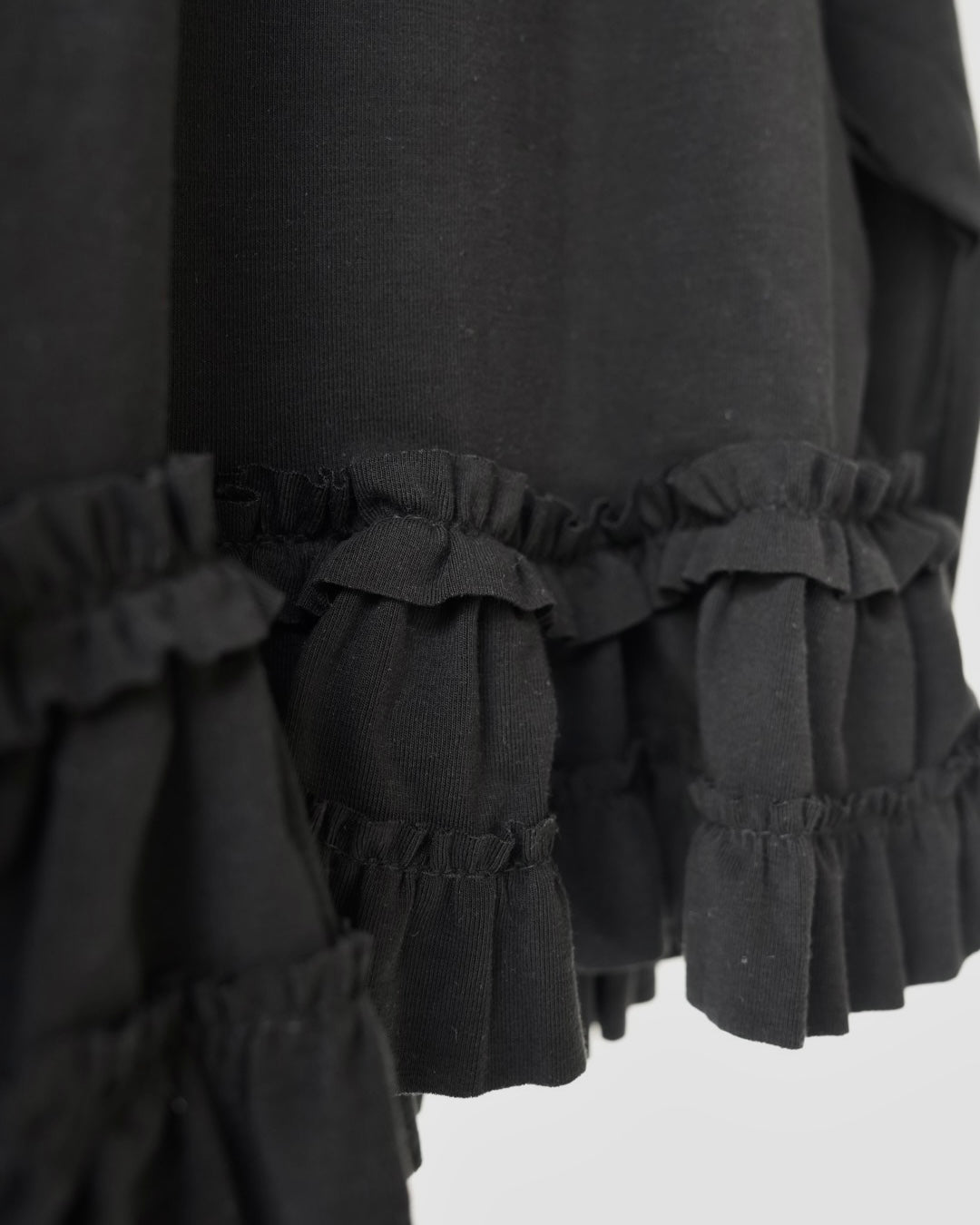 裾フリルトップス