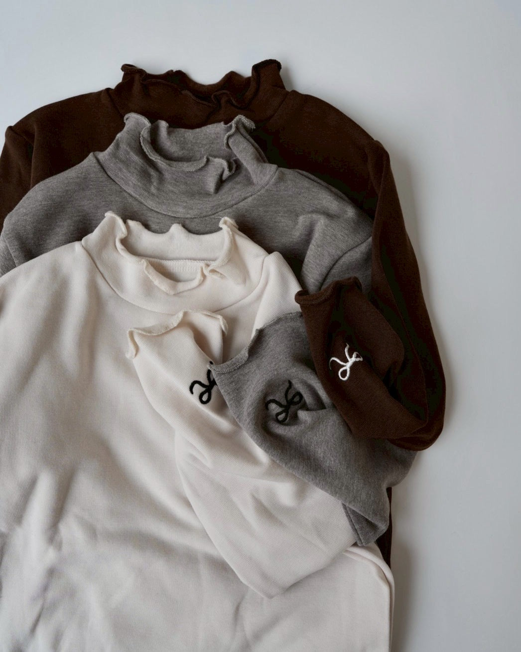 リボンステッチスムースメロウトップス