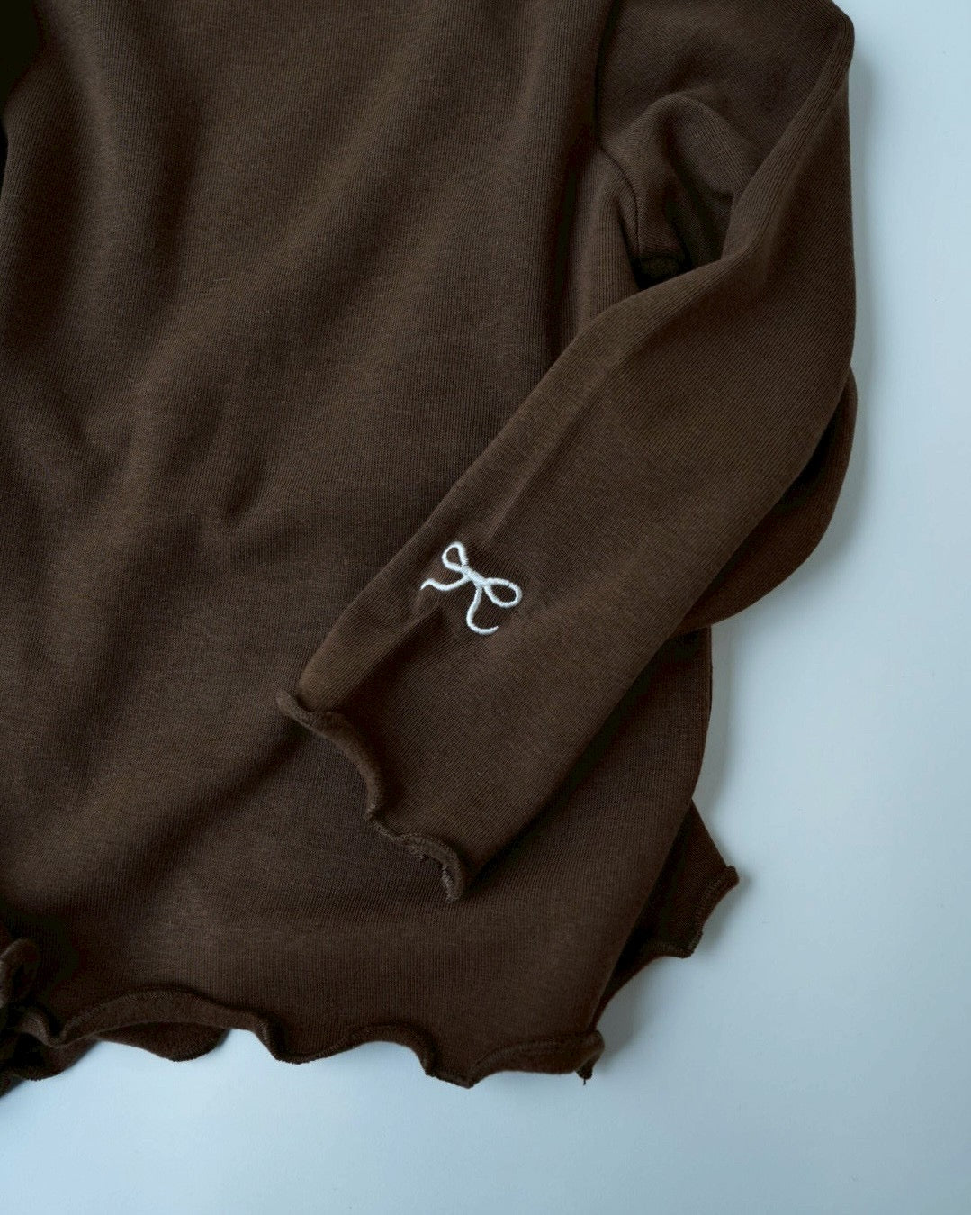 リボンステッチスムースメロウトップス